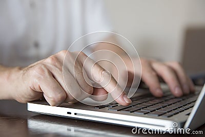 Hands on a computer keyboard Stock Photo