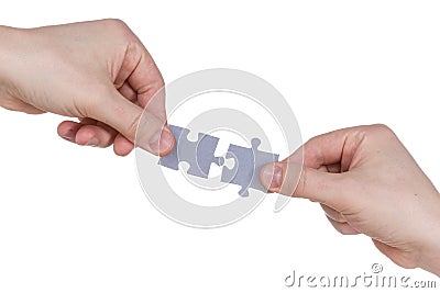 Hands connecting jigsaw puzzle Stock Photo