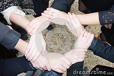 Hands connecting to a chain Meeting Seminar Stock Photo