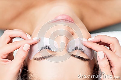 Hands puts strip under eye Stock Photo