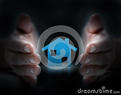 Hands cover a house Stock Photo