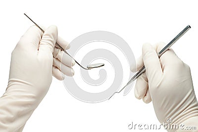 Hands of dentist holding his tools Stock Photo