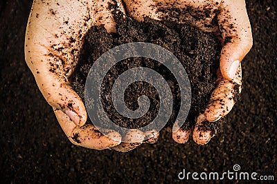 Hands dirty with clay , soil background Stock Photo