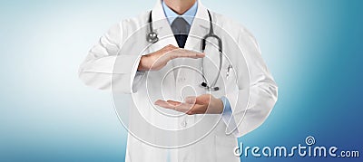 Hands doctor close up, medical coverage insurance concept, in blue blurred background with copy space Stock Photo