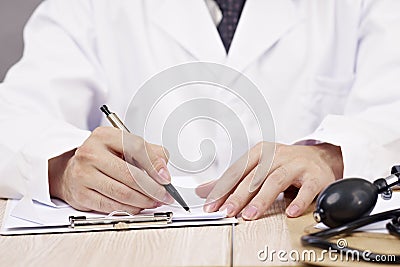 Hands of doctor writing Stock Photo