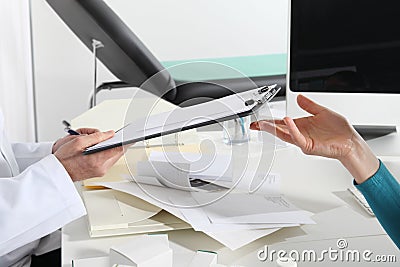 Hands of doctors, consult and exchange prescription documents, Stock Photo