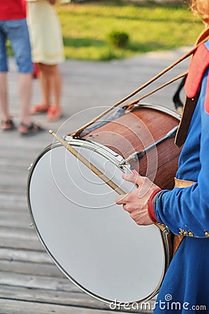 hands with drum sticks and a big drum Stock Photo