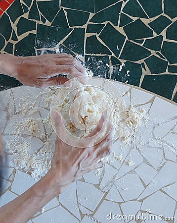Woman preparing bread dough Stock Photo