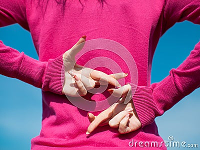 Hands of female person in pink blouse Stock Photo