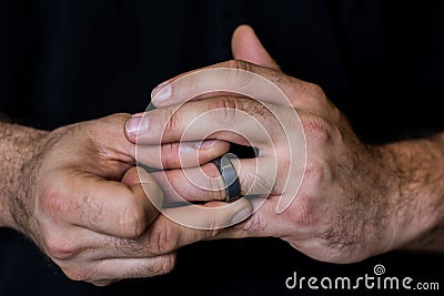 Hands Fidgeting with Ring Stock Photo