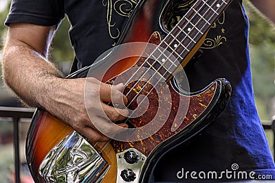 Hands and fingers playing eletric bass Stock Photo