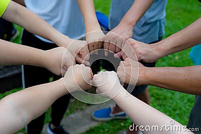 Hands fist join together as commitment of strong team work Stock Photo