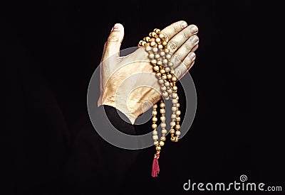 Hand with a rosary isolated on white background Stock Photo