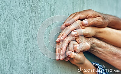 Hands of four generations close-up . Stock Photo