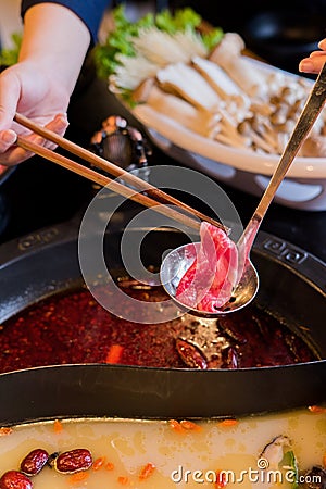 Hands on frame hot pot hotpot szechuan chongqing Stock Photo