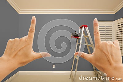 Hands Framing Grey Painted Wall Interior Stock Photo