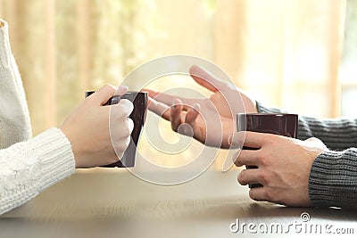 Hands of friends with coffee cups Stock Photo