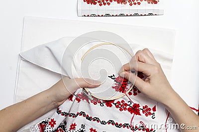 Hands girls embroider pattern using the frame. Stock Photo