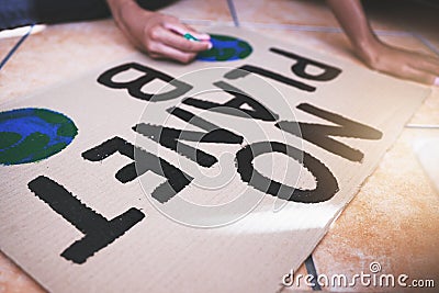 Hands, global warming and protest writing on cardboard woman support environment sustainability, clean energy and Stock Photo