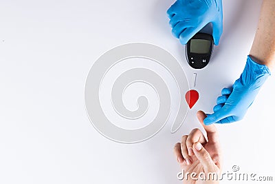 Hands of gloved doctor with glucometer taking blood sugar reading from caucasian woman, copy space Stock Photo