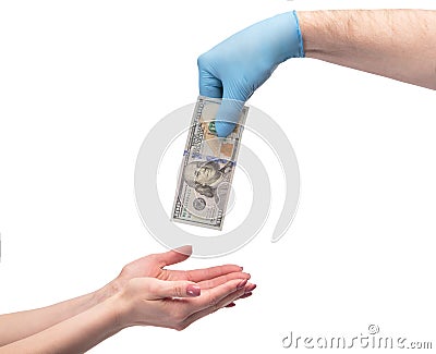 Hand in medical gloves giving money over white background Stock Photo