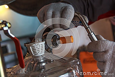 Hands with gloves repair car Stock Photo