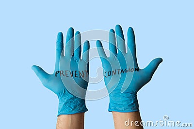 Hands with gloves with written on it prevent the infection. Health prevention and safety concept Stock Photo