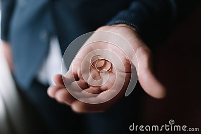 Hands of groom with rings Stock Photo