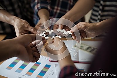 Hands group of business people assembling jigsaw puzzle white. B Stock Photo