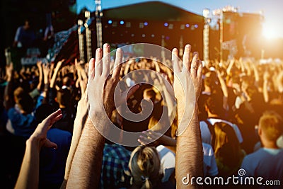 Hands of happy people crowd having fun at summer live rock fest Editorial Stock Photo