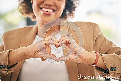 Hands, heart and business woman with love emoji for care, kindness and like in office. Closeup of happy female worker Stock Photo
