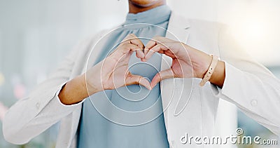 Hands, heart and business woman with love emoji for care, kindness and symbol in office. Closeup of happy female worker Stock Photo