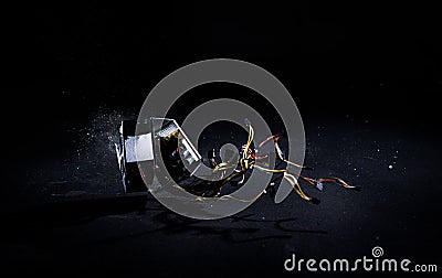 Hands hitting PC power supply on the floor, demolish and break PSU, slow motion Stock Photo
