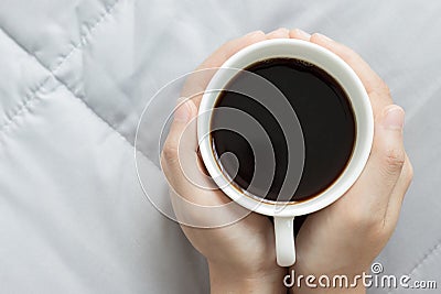 Hands hold a cup of coffee Stock Photo