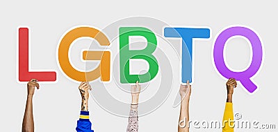 Hands holding the abbreviation LGBTQ Stock Photo