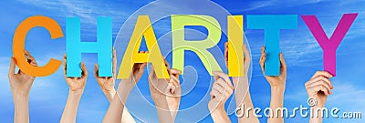 Hands Holding Colorful Straight Word Charity Sky Stock Photo