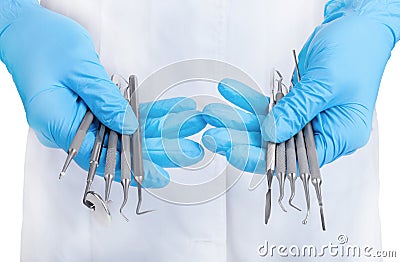 Hands holding dental instruments Stock Photo