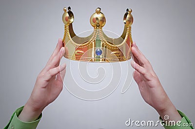 Golden crown above a head. Stock Photo