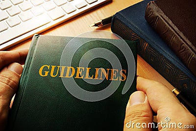 Hands holding Guidelines. Stock Photo