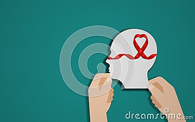 Hands Holding human Head shape With Heart Ribbon. paper brain and cancer ribbon in blue background. Cancer Awareness Month and Stock Photo