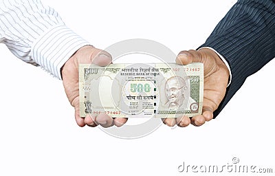 Hands Holding indian money Stock Photo