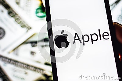 Hands holding iPhone X with Apple company logo on the screen. Editorial Stock Photo