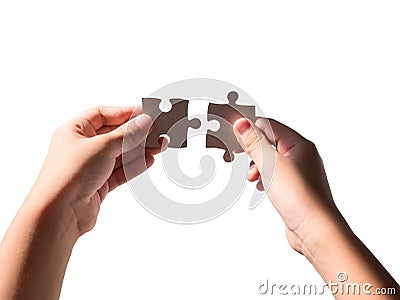 Hands holding jigsaws Stock Photo
