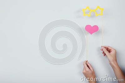 Hands holding paper booth props Stock Photo