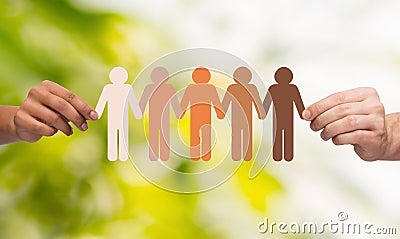 Hands holding paper chain multiracial people Stock Photo