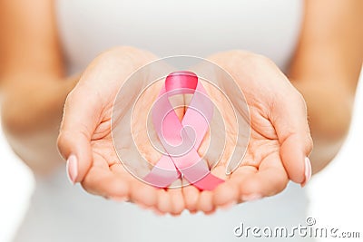 Hands holding pink breast cancer awareness ribbon Stock Photo