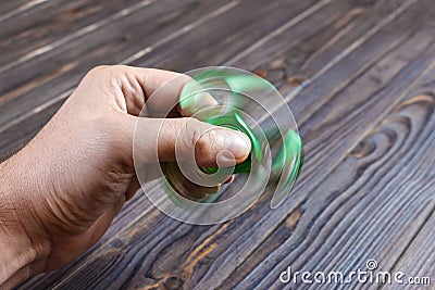 Hands holding popular fidget spinner toy. fidgeting spinner Stock Photo