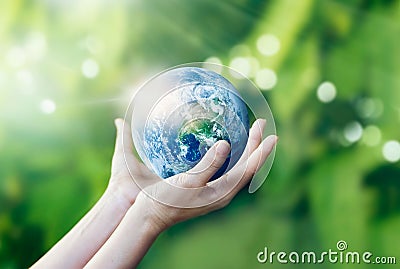 Hands holding and protect earth on nature background Stock Photo