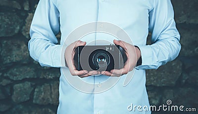 Hands holding retro camera. Stock Photo