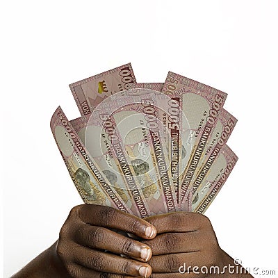 hands holding 5000 Rwandan franc notes. closeup of Hands holding Rwandan currency notes Stock Photo